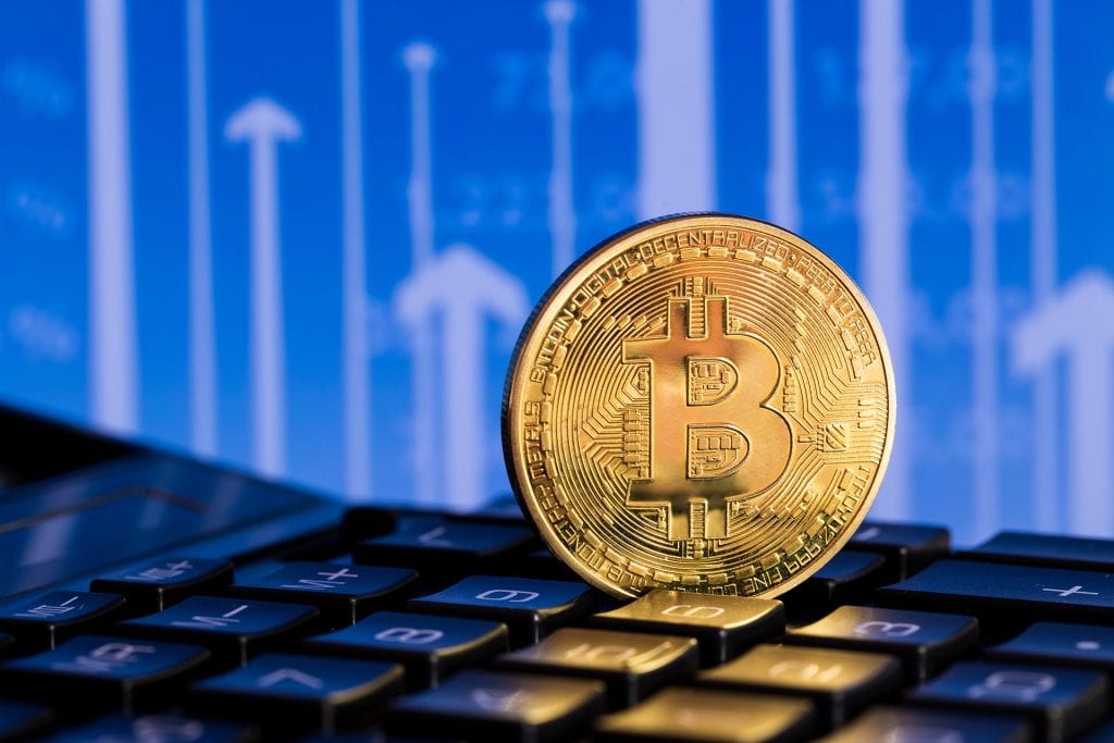 one bitcoin on blue background | CryptoGazette - Cryptocurrency News
