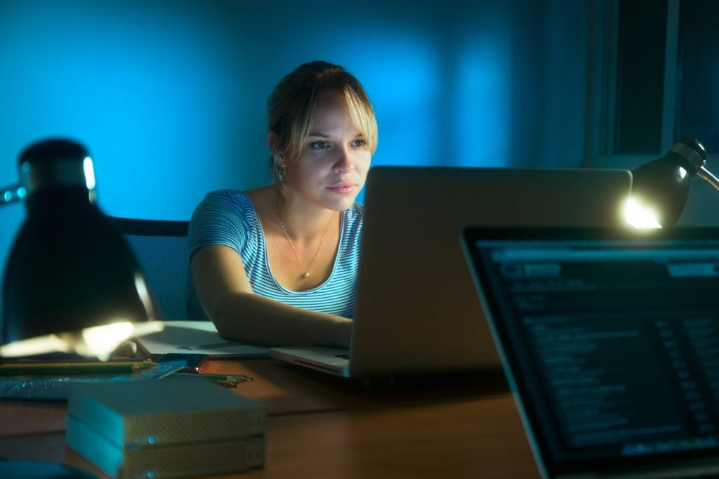 Woman Writing On Laptop Computer Late At Night | CryptoGazette - Cryptocurrency News Woman Writing On Laptop Computer Late At Night
